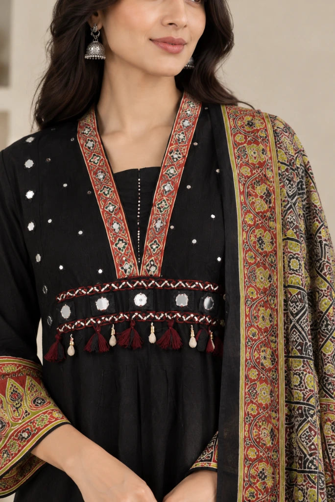 Ajrakh-style green and red printed dupatta draped over black kurta