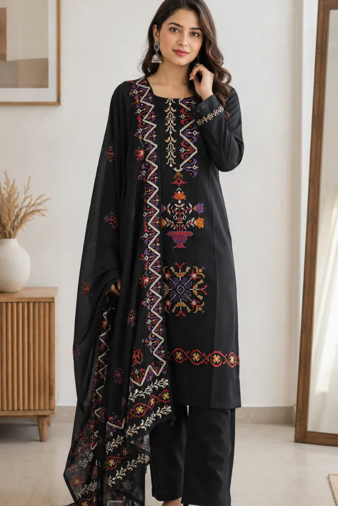 Black straight pants styled with embroidered kurta and black strappy heels
