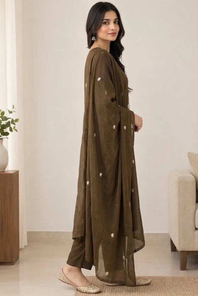 Brown straight pants with hem slit styled with beige juttis and sheer dupatta