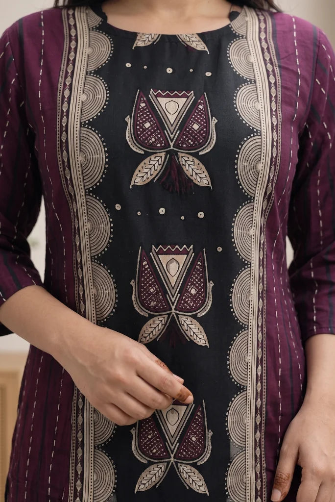 Close-up of black round-neck kurta centre with cream lotus motifs and scalloped border