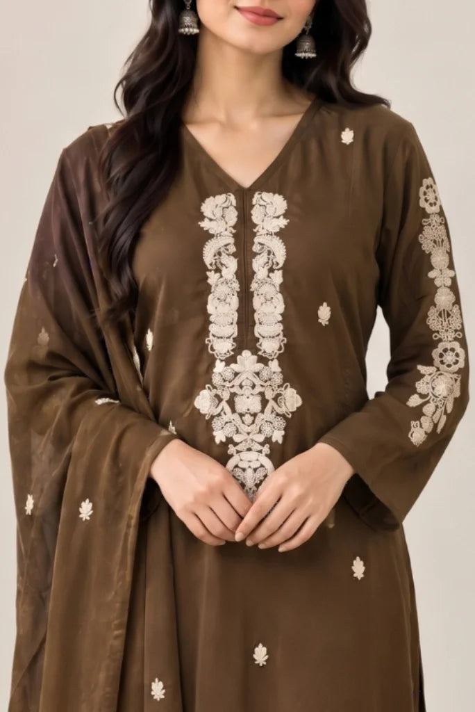 Close-up of cream floral embroidery panel on brown V-neck kurta