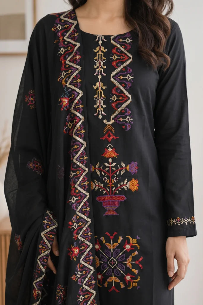 Close-up of multicolour cross-stitch placket and neckline on black kurta