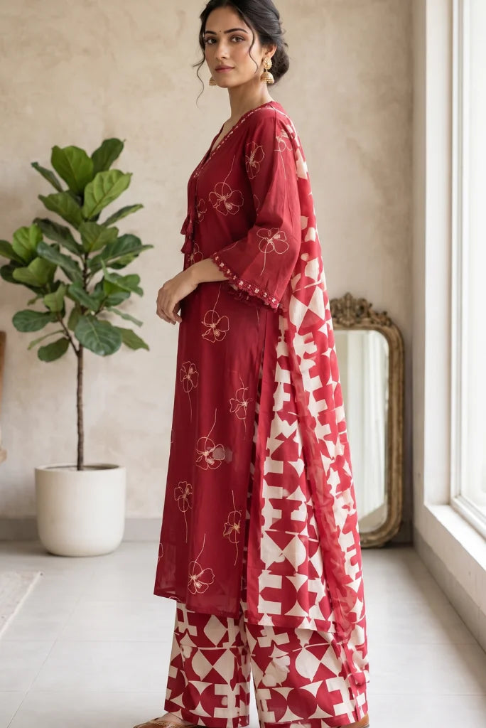 Geometric print palazzo and dupatta in maroon and cream styled with golden juttis side view