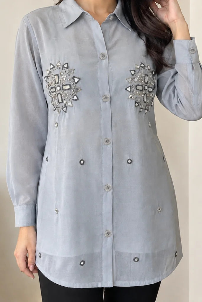 Gorgeous handcrafted mirror-work and sequence patches on both sides of the chest front half view