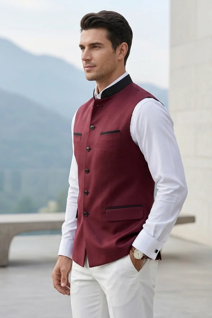 Man wearing a maroon sleeveless Nehru jacket with a mandarin collar -side