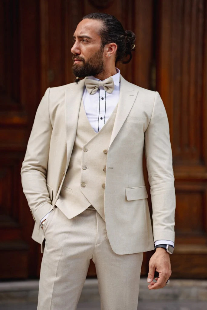 Bespoke cream three piece suit for groom wedding