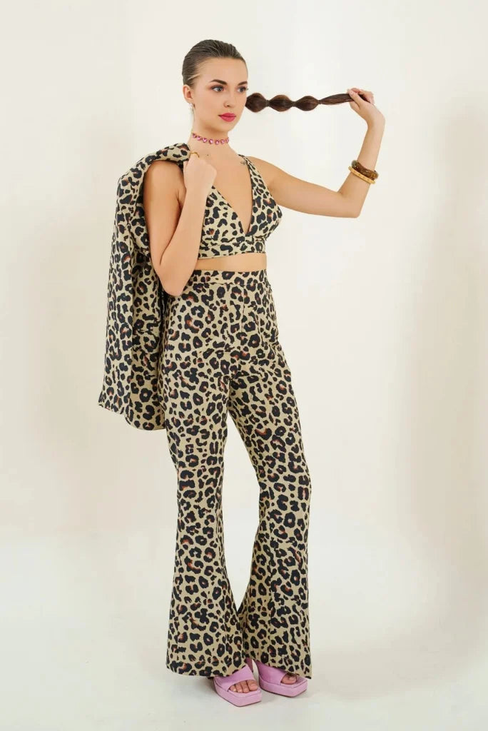 Woman wearing leopard print cotton 3-piece co-ord set with blazer, bralette and bootcut pants